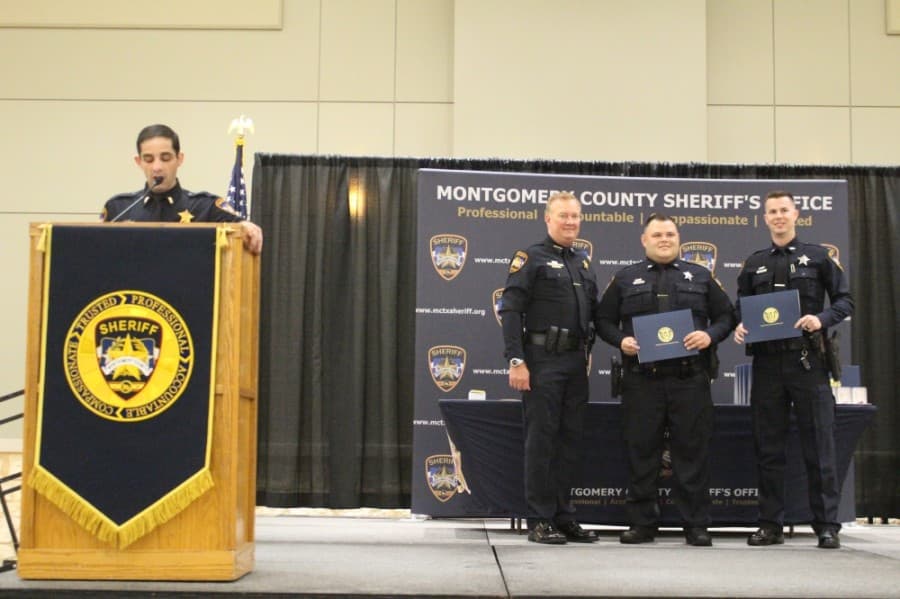 Referencing the general public mistrust of law enforcement following George Floyd's death, Montgomery County Sheriff Rand Henderson, second from left, said at the awards ceremony: "Right now may be a time you want to hang your head. Please don't do that." (Eva Vigh/Community Impact Newspaper)
