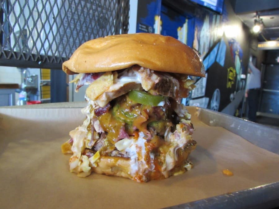 The Donk is a 1-pound sandwich that includes every meat served at SLAB. (Nicholas Cicale/Community Impact Newspaper)