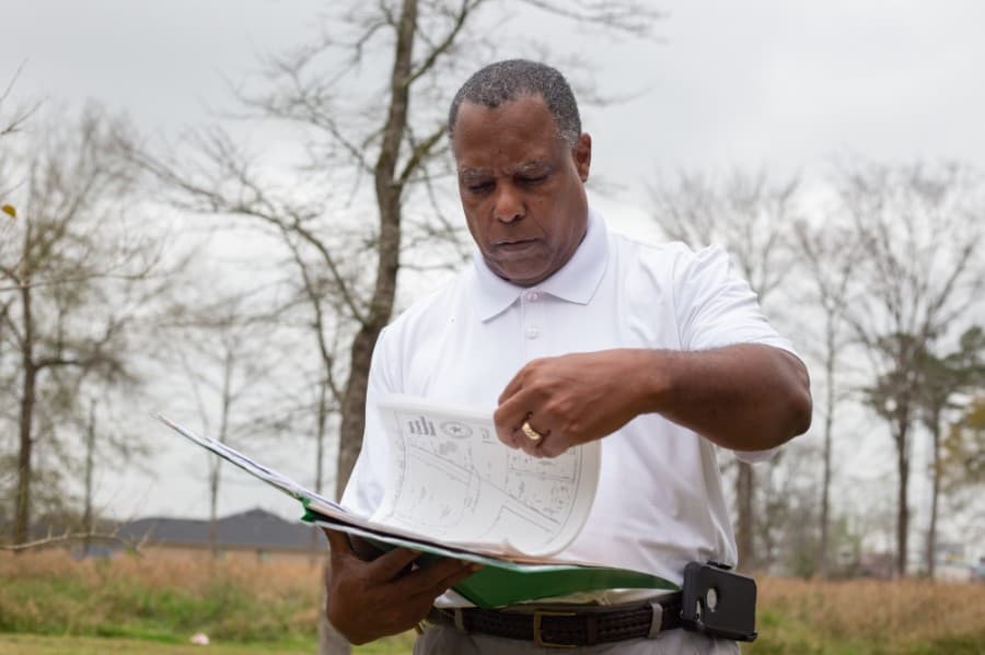 Charles Cunningham hopes to get the Humble Pipeyard Cemetery a historical landmark
status within two years. (Trevor Nolley/Community Impact Newspaper)