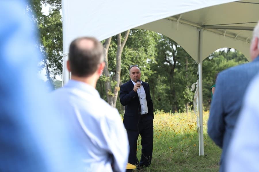 Realty Capital Managing Director Jimmy Archie urged those present to remember the views around them and to spread the word about the project. (Liesbeth Powers/Community Impact Newspaper)