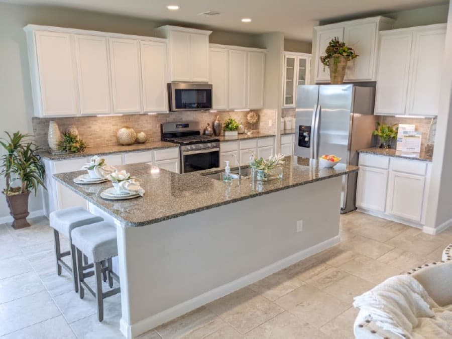 The kitchen includes a large island counter. (Jake Magee/Community Impact Newspaper)