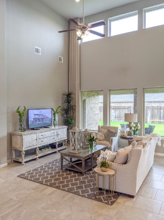 The home includes a living room with a high ceiling. (Jake Magee/Community Impact Newspaper)