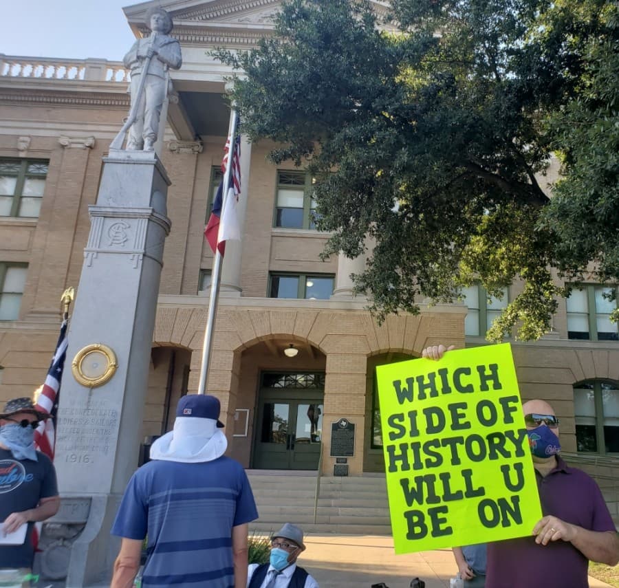 Protesters seek the removal of the Confederate statue on the Georgetown Square on July 14. (Ali Linan/Community Impact Newspaper)