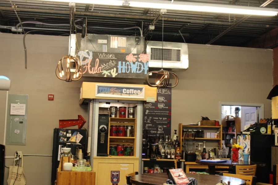 Coffee is made at the back of the shop after an order is place at TexaKona. (Miranda Jaimes/Community Impact Newspaper)