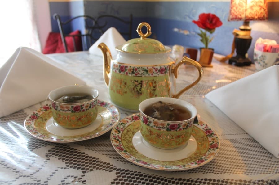 Holly Berry’s Tea Room serves a variety of hot and iced teas that are served in vintage tea sets. (Jake Magee/Community Impact Newspaper)