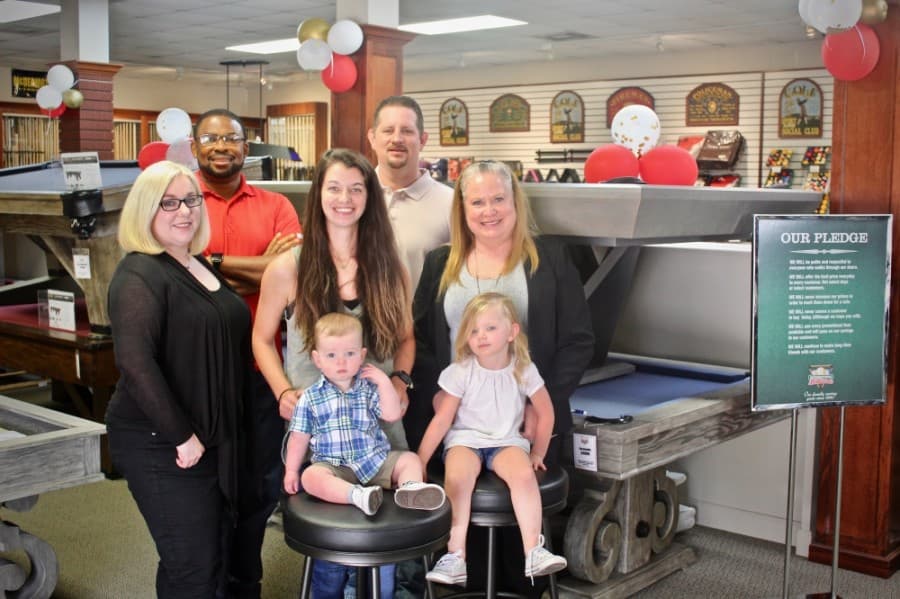 Pictured, from left, are Eliza Cox, Samuel James, Heather Heacock, Grady House, Kim Morrison Murdock and Hudson and Raeleigh—Heather’s children and Kim’s grandchildren—who mark the fifth generation of the International Billiards family. 

