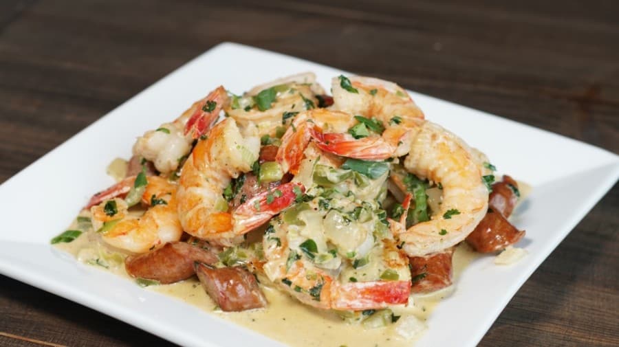 A Southern favorite, the Shrimp 'N Grits ($15.95) include a plate of Gulf shrimp and smoked sausage doused in Creole sauce over fried grit cakes. (Courtesy Raydon Creative)