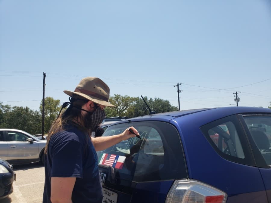 Members of the community came out to support the Pushing for Justice Caravan for Javier Ambler on Aug. 15. (Ali Linan/Community Impact Newspaper)