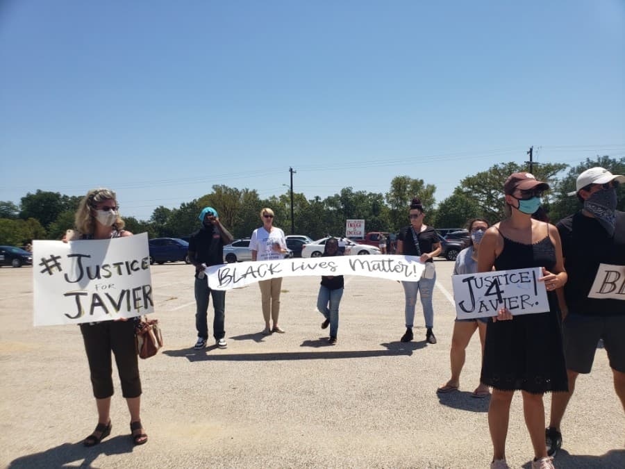 Members of the community came out to support the Pushing for Justice Caravan for Javier Ambler on Aug. 15. (Ali Linan/Community Impact Newspaper)