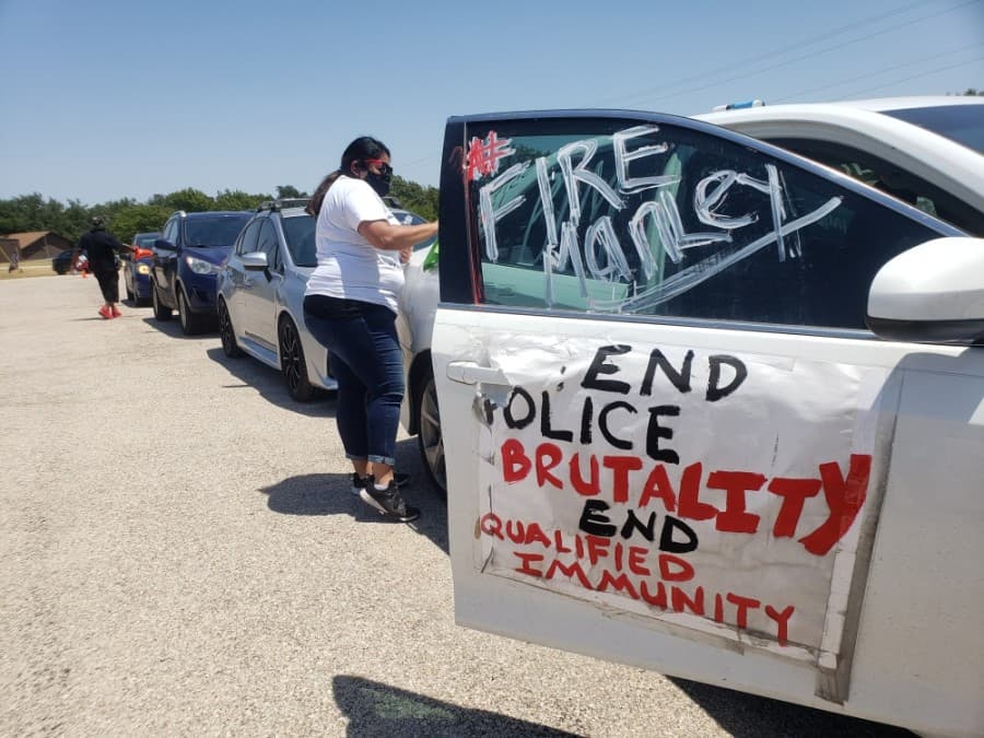 Members of the community came out to support the Pushing for Justice Caravan for Javier Ambler on Aug. 15. (Ali Linan/Community Impact Newspaper)