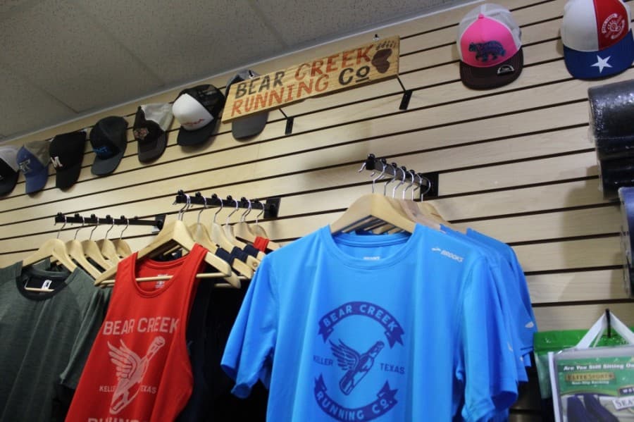 Apparel options include hats, T-shirts and fitness accessories. (Ian Pribanic/Community Impact Newspaper)