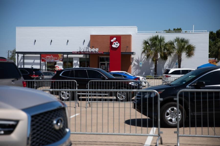 Cars wrap around Jollibee parking lot on first day open in Plano