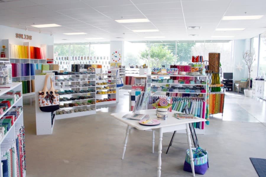 The full-service quilt shop offers threads, fabrics, long-arm services, and a variety of sewing and quilting classes. (Courtesy Stitched with Love)
