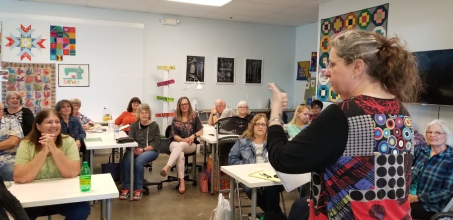 Popular classes at the shop include classes on sewing with cork and piecing quilts. This photo was taken before Stitched with Love's face mask requirement. (Courtesy Stitched with Love)