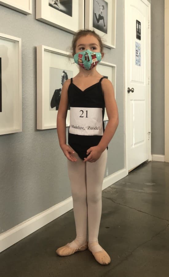 Dance student Madeline Zundel poses in her dance attire and face mask. (Courtesy Bay Area Houston Ballet & Theatre)