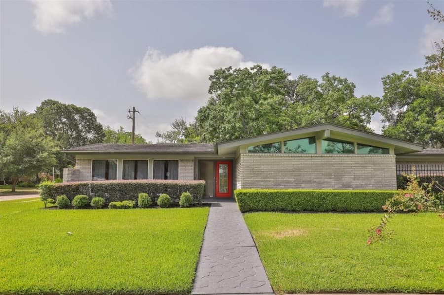 5503 Stillbrooke Drive, Houston: A midcentury home with 2,422 square feet built in 1962 and located within walking distance of Parker Elementary and Westbury Park and Neighborhood Swimming Pool, it features a kitchen with a butler’s pantry, a walk-in pantry, a bar on both sides and granite countertops with natural stone and glass tile backsplash. It sold for $285,001-$325,000 on Aug. 6. (Courtesy Houston Association of Realtors)