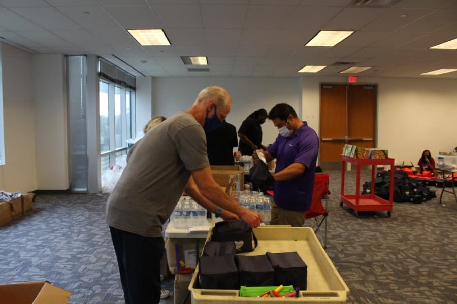 Local businesses came together Sept. 1 to pack the kits. (Elizabeth Uclés/Community Impact Newspaper)