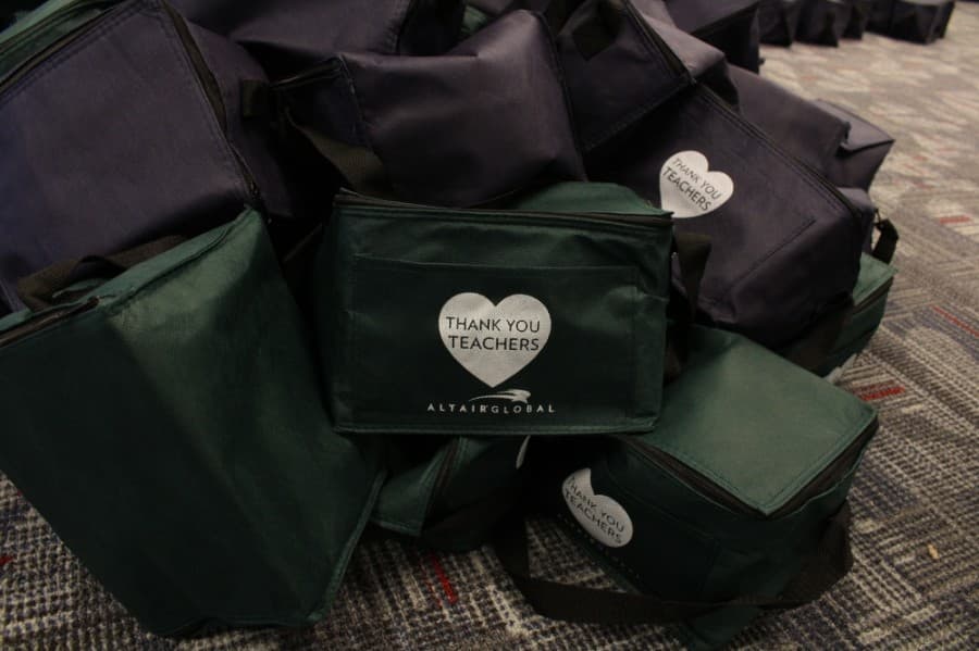 The kits contain hand sanitizer, gloves, face masks, water bottles and gift cards in a lunch cooler. (Elizabeth Uclés/Community Impact Newspaper)