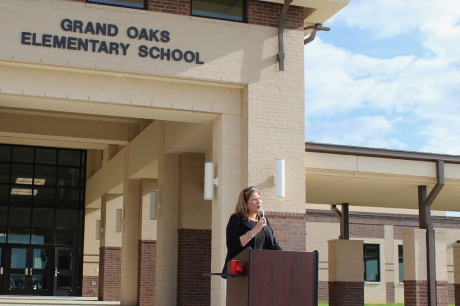 Superintendent Martha Salazar-Zamora addressed district officials, community representatives and construction partners during the Sept. 4 ribbon cutting for Grand Oaks Elementary School, the district's 11th elementary school. (Anna Lotz/Community Impact Newspaper)