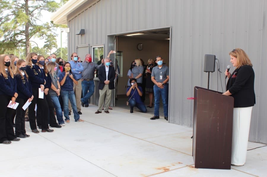 Tomball ISD officials, board members, students and community members celebrated the completion of the Tomball High School Agricultural Science Project Center, located behind the high school, with a ribbon cutting ceremony Sept. 4. (Anna Lotz/Community Impact Newspaper)