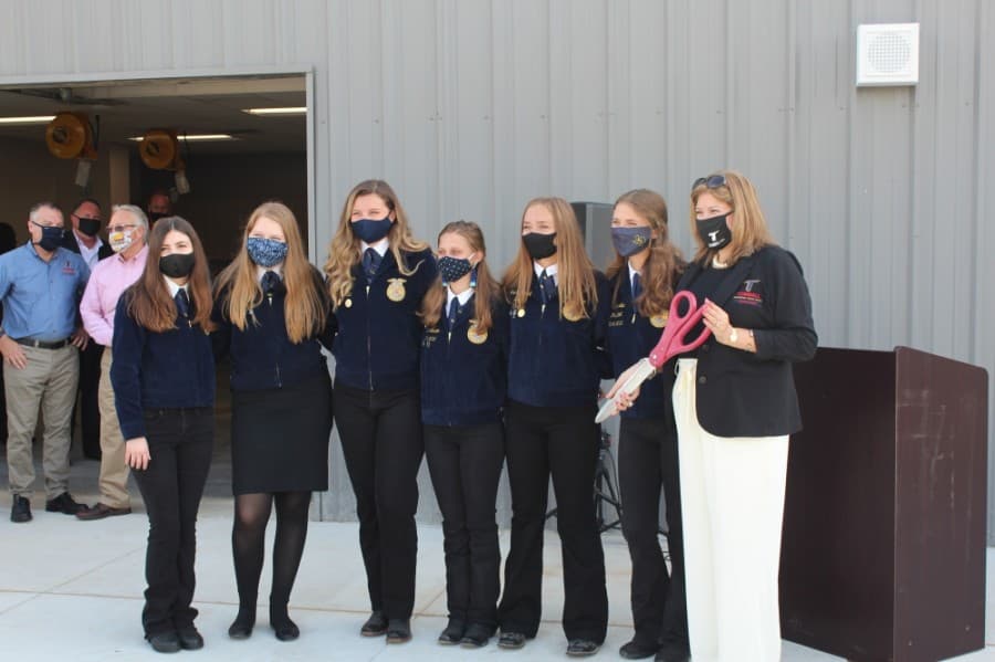Several FFA students from Tomball Memorial and Tomball high schools attended the ribbon cutting with district leadership Sept. 4. (Anna Lotz/Community Impact Newspaper)