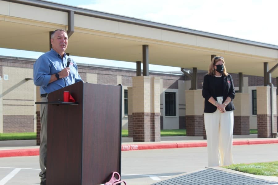 Board President Michael Pratt addressed district leaders and community members at the Sept. 4 ribbon cutting for Grand Oaks Elementary School. (Anna Lotz/Community Impact Newspaper)