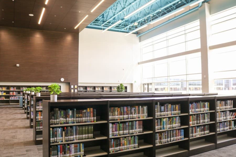 The library is home to educational resources and provides collaboration space. (Courtesy PBK Architects)