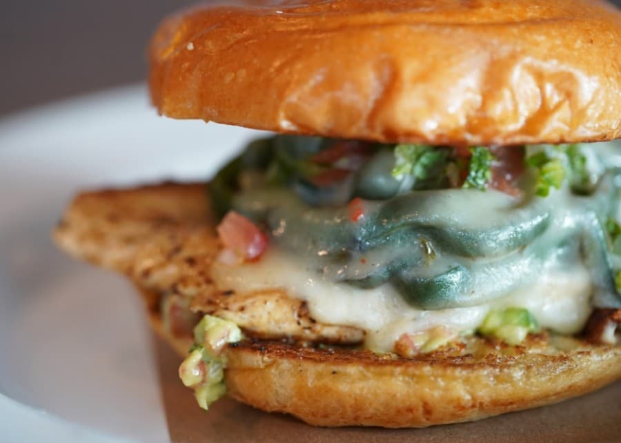 The Taos Chicken Sandwich comes with poblano peppers, pico de gallo, pepper jack cheese and guacamole. (Courtesy Haystack Burgers & Barley)