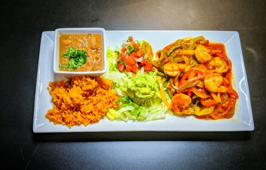 Camarones a la Diabla ($13.75): Jumbo shrimp and veggies are served in spicy red salsa made from chile de arbol with lettuce, tomato, pico, charro beans and rice. (Courtesy Tex-Mex Grill and Bar)