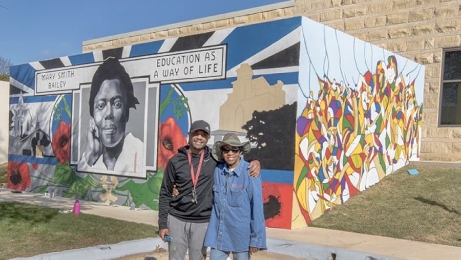 Devon Clarkson, left with his half of the mural, and Norma Clark, right with her half, stand alongside their project in February 2020. (Courtesy city of Georgetown) 