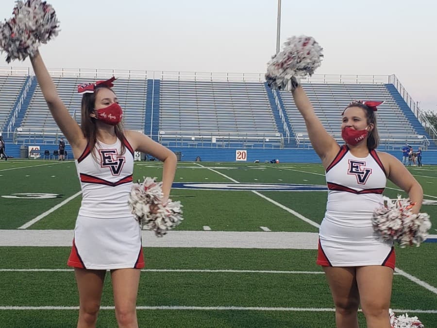East View High School student cheerleaders cheer on the sidelines during a Sept. 18 scrimmage game. (Ali Linan/Community Impact Newspaper)