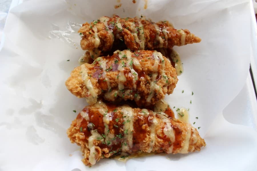 Chicken tenders served with garlic parmesan jerk sauce is just one of many combinations diners can order at Tasty's. (Olivia Lueckemeyer/Community Impact Newspaper)