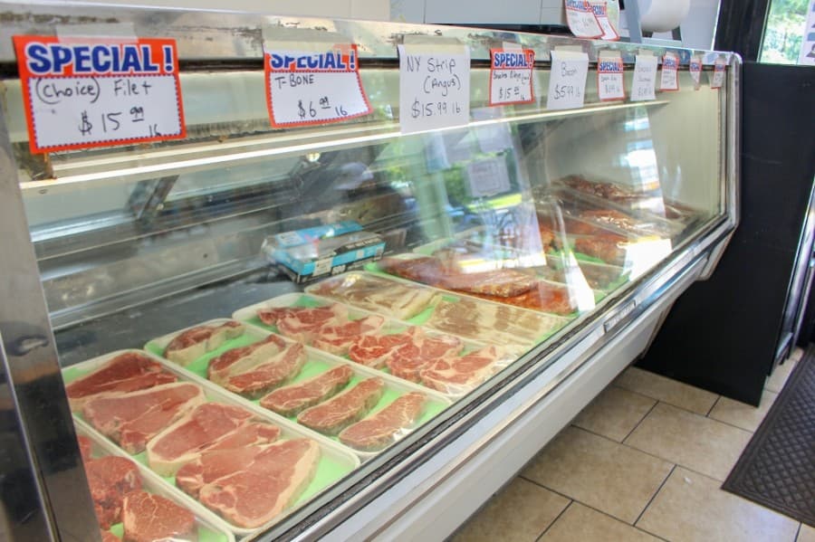Kingwood Meat Market sells various fresh-cut meats, including pan sausage, ribeyes and T-bone steaks. (Kelly Schafler/Community Impact Newspaper)
