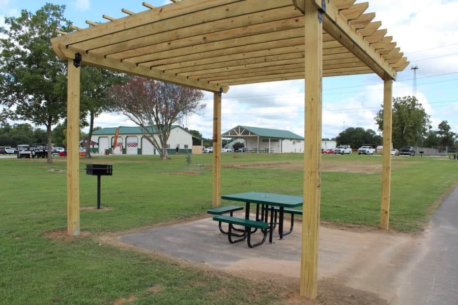Broussard Park features amenities, such as pergolas, picnic tables and barbecue grills. (Anna Lotz/Community Impact Newspaper)