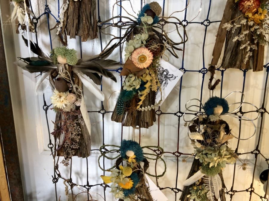 Donna Bennett makes these angels from cedar bark. (Sally Grace Holtgrieve/Community Impact Newspaper)