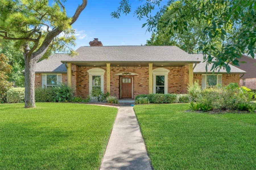 5803 S. Braeswood Blvd., Houston: Built in 1962, this 2,416-square-foot home features a new water heater, roof, gutters and double-paned windows along with a redone patio and front porch. It also features four formal bedrooms and two bathrooms, a fireplace den, a breakfast area, utility room and an open kitchen. It sold for $185,001-$215,000 on Sept. 11. (Courtesy Houston Association of Realtors)