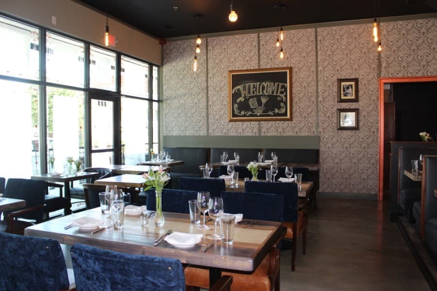 The look and concept of CT Provisions was created in-house, with restaurant owners and stakeholders sanding the wood on the tables themselves and choosing paint colors. (Miranda Jaimes/Community Impact Newspaper)