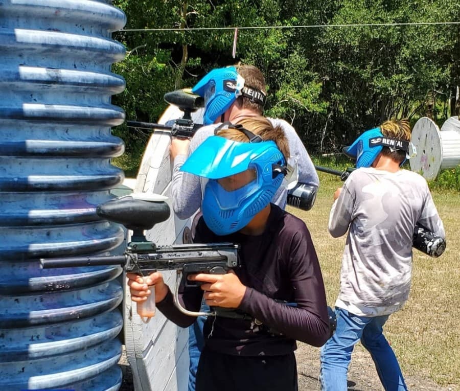 A younger player takes aim behind an obstacle at TXR Paintball. (Courtesy TXR Paintball)