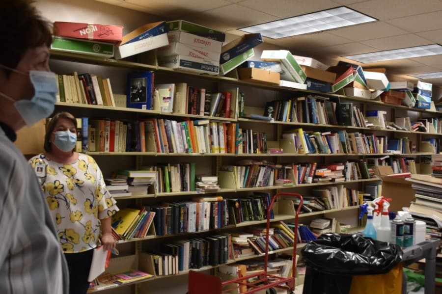 Richardson Friends of the Library use the basement storage room to house books for book sales. Library staff wants to expand this space, they said on the tour. (Makenzie Plusnick/Community Impact Newspaper)