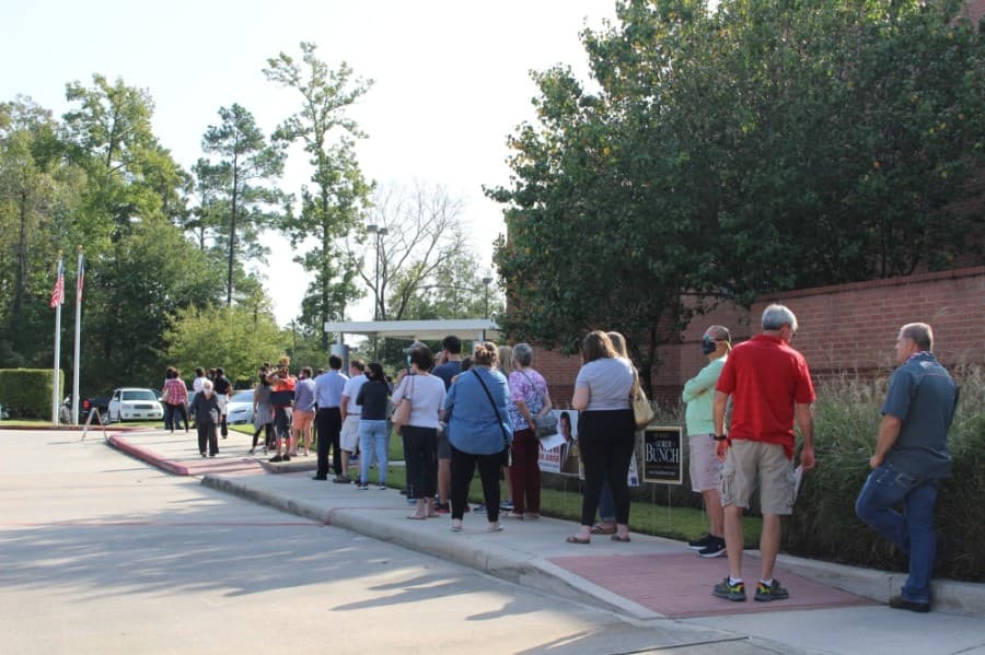 Dozens of voters waited in line to cast their ballots on the first day of early voting at the George and Cynthia Woods Mitchell Library in The Woodlands Oct. 13. (Ben Thompson/Community Impact Newspaper)