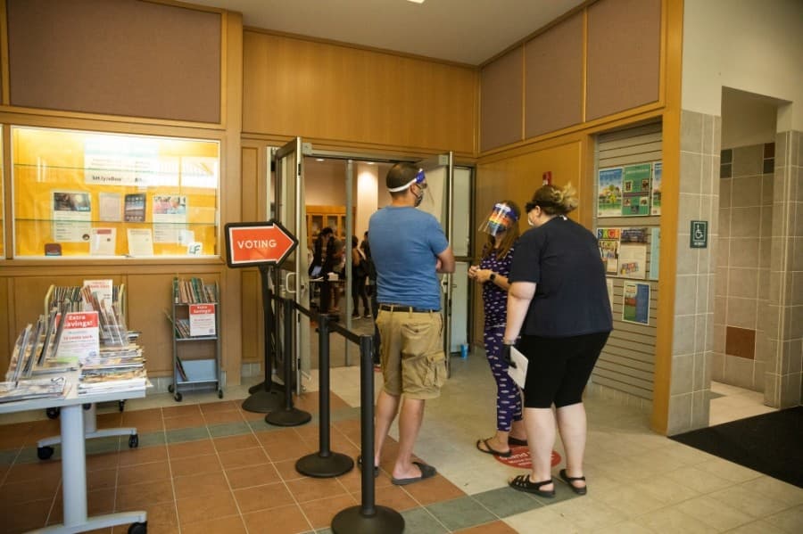 Wait times were around 30 minutes at Plano's Davis Library following the first wave of voters in the morning of Oct. 13. (Liesbeth Powers/Community Impact Newspaper)