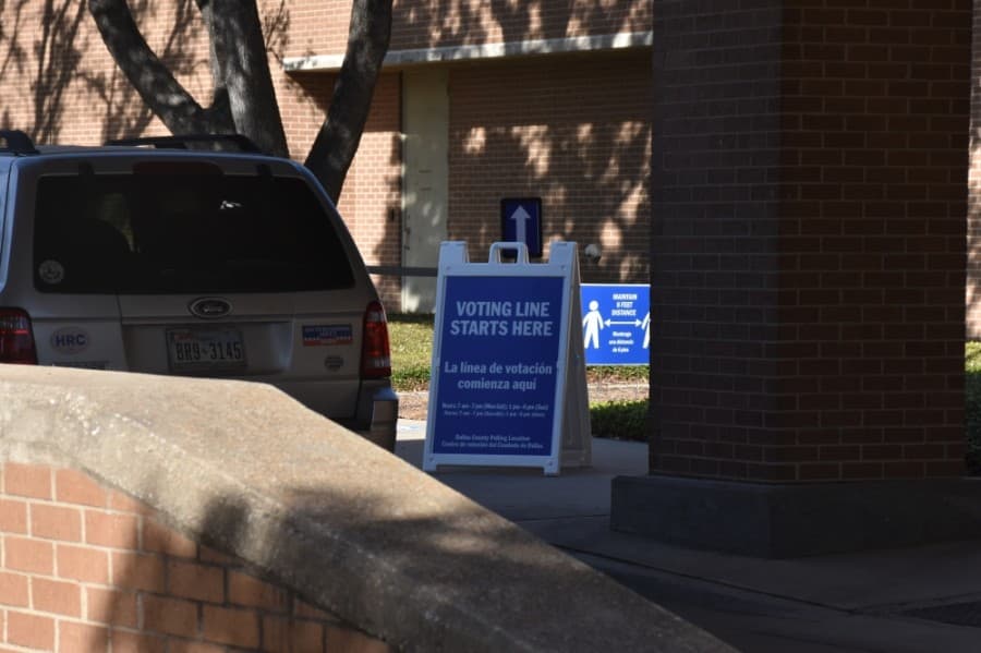 The county prepared for long lines by setting up signs around the building to guide voters. (Makenzie Plusnick/Community Impact Newspaper)
