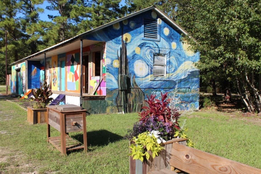 Artists local to the Magnolia area have covered the buildings in murals since the spring, which have now become popular photo backgrounds for community members.