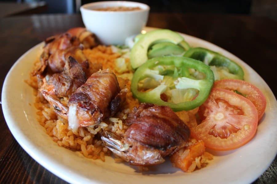 Louis' favorite shrimp: This dish features bacon-wrapped shrimp stuffed with jalapenos and cheese. (Daniel Houston/Community Impact Newspaper)