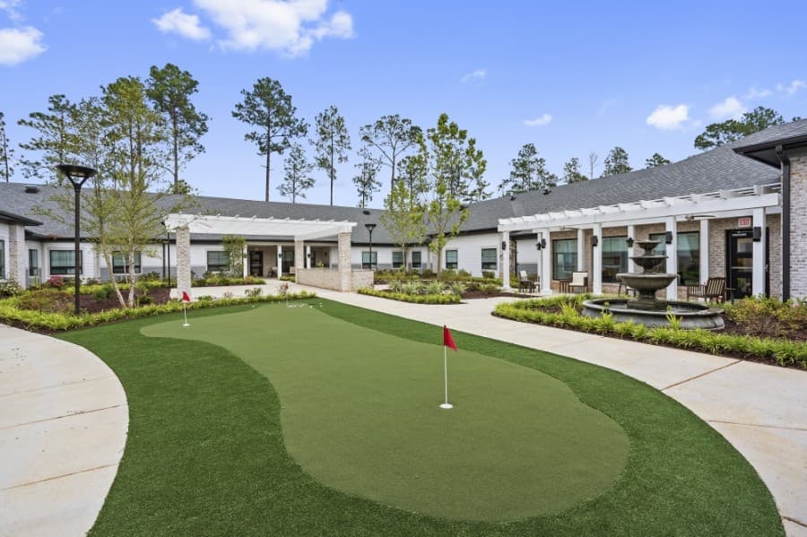 Outdoor amenities highlighted include three courtyards, a golf putting green, a dog park and an outdoor kitchen. (Rendering courtesy Investcor Development)