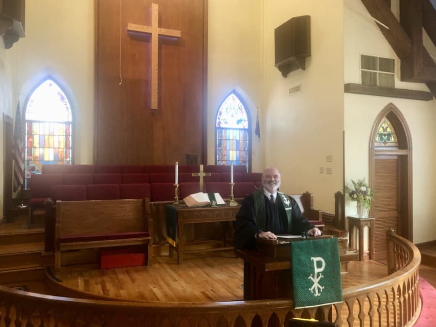 Reverend Darren Walker records a video sermon inside the recently renovated chapel. (Sally Grace Holtgrieve/Community Impact Newspaper)