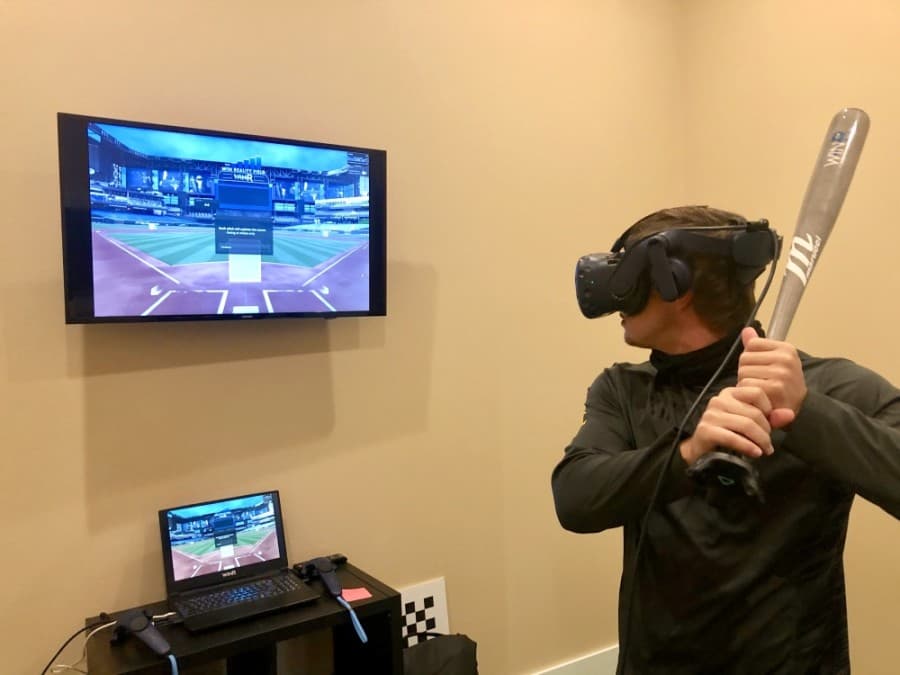 Kyle Gray with the New York Yankees practices using a virtual reality program. (Sally Grace Holtgrieve/Community Impact Newspaper)