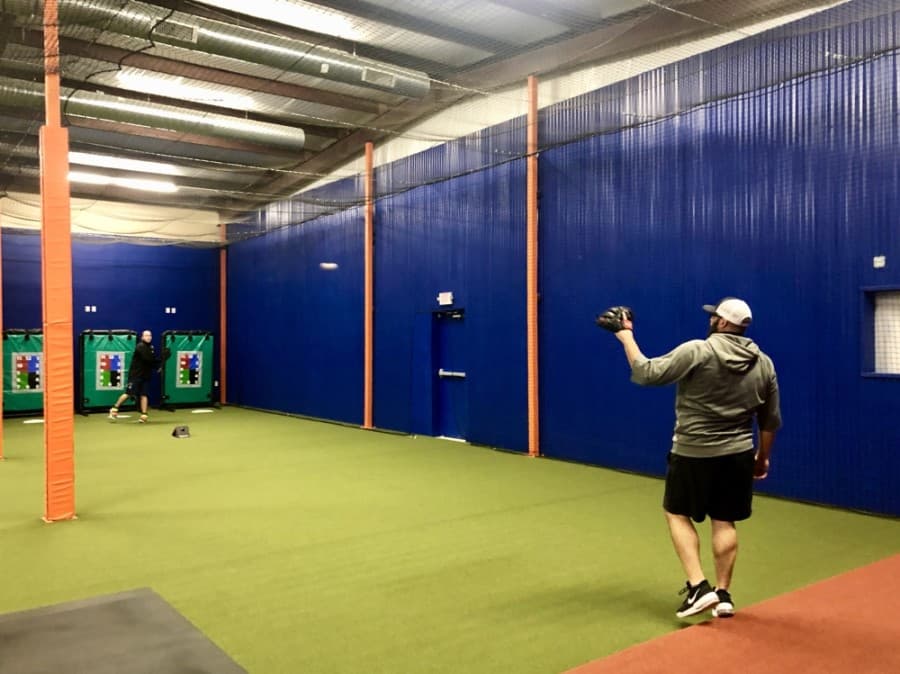 Scott Lacey, a pitching coach at Southwestern University, throws with Sean Gallagher, a six-year Major League Baseball player and area scout for the Kansas City Royals. (Sally Grace Holtgrieve/Community Impact Newspaper)