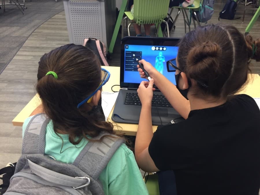 Brookside Intermediate science magnet students spend time in the library, exploring science applications and performing experiments. (Courtesy Clear Creek ISD)