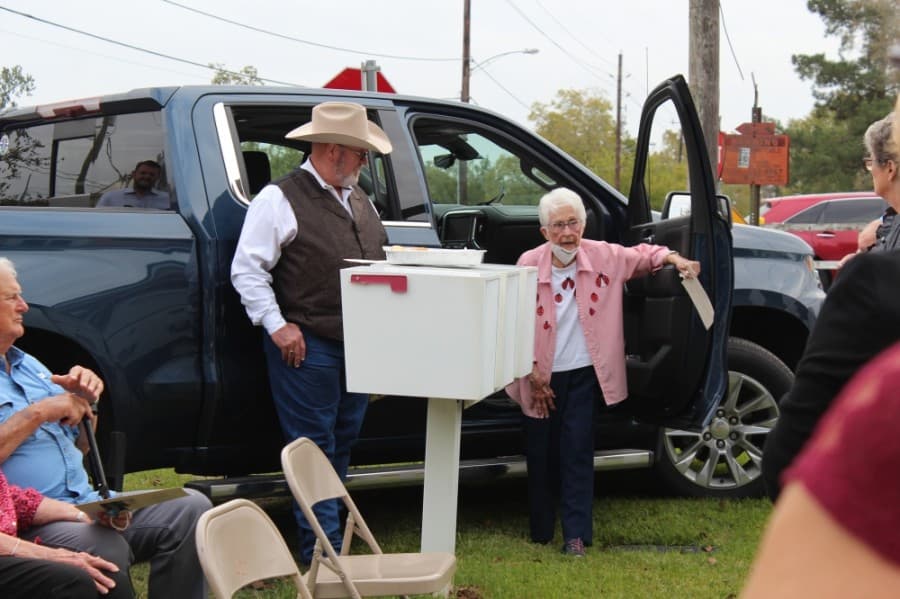 Local historian Celeste Graves, author of "Magnolia Memories," spoke during the marker dedication Oct. 26. (Anna Lotz/Community Impact Newspaper)